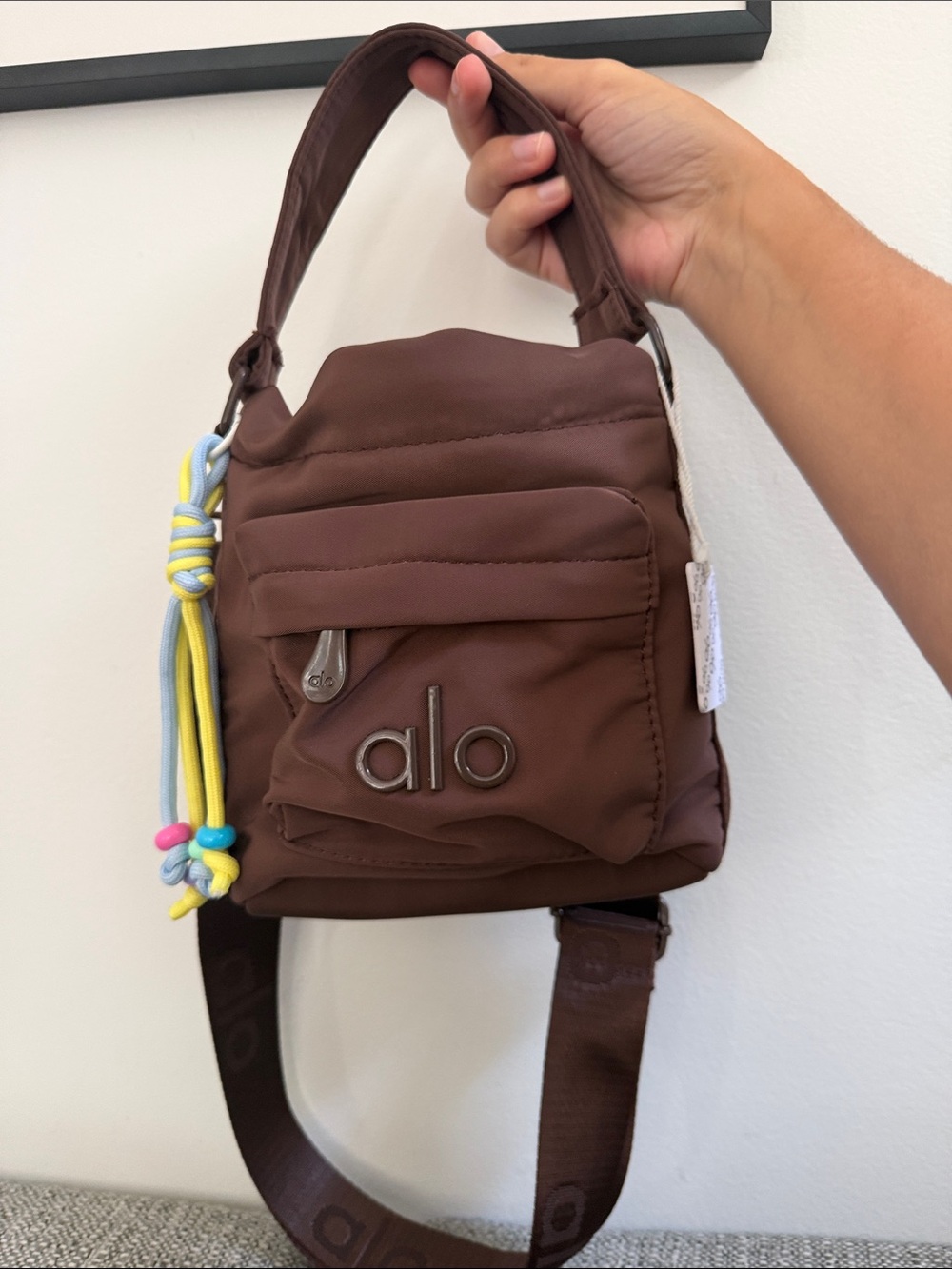 ALO Yoga Brown Drawstring Mini Crossbody Bag with Tassel Accent